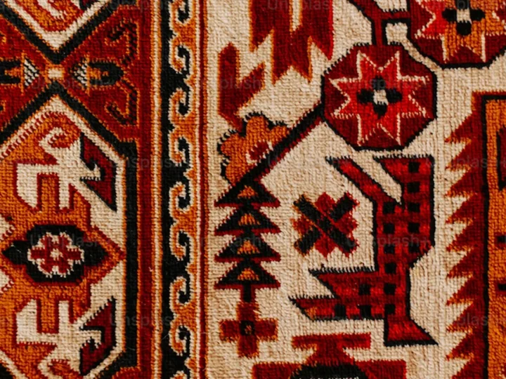 Close-up of a handmade silk carpet pattern
